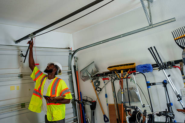 Professional Garage Door Panel Replacement technician working in Alpine, NJ